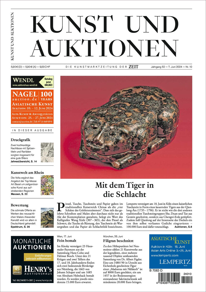 Titelseite der Zeitschrift 'KUNST UND AUKTIONEN' vom 24. Oktober. Hauptbild zeigt eine künstlerische Darstellung eines Tigers in dunklen Farben. Textblöcke und Anzeigen sind entlang der Ränder angeordnet.