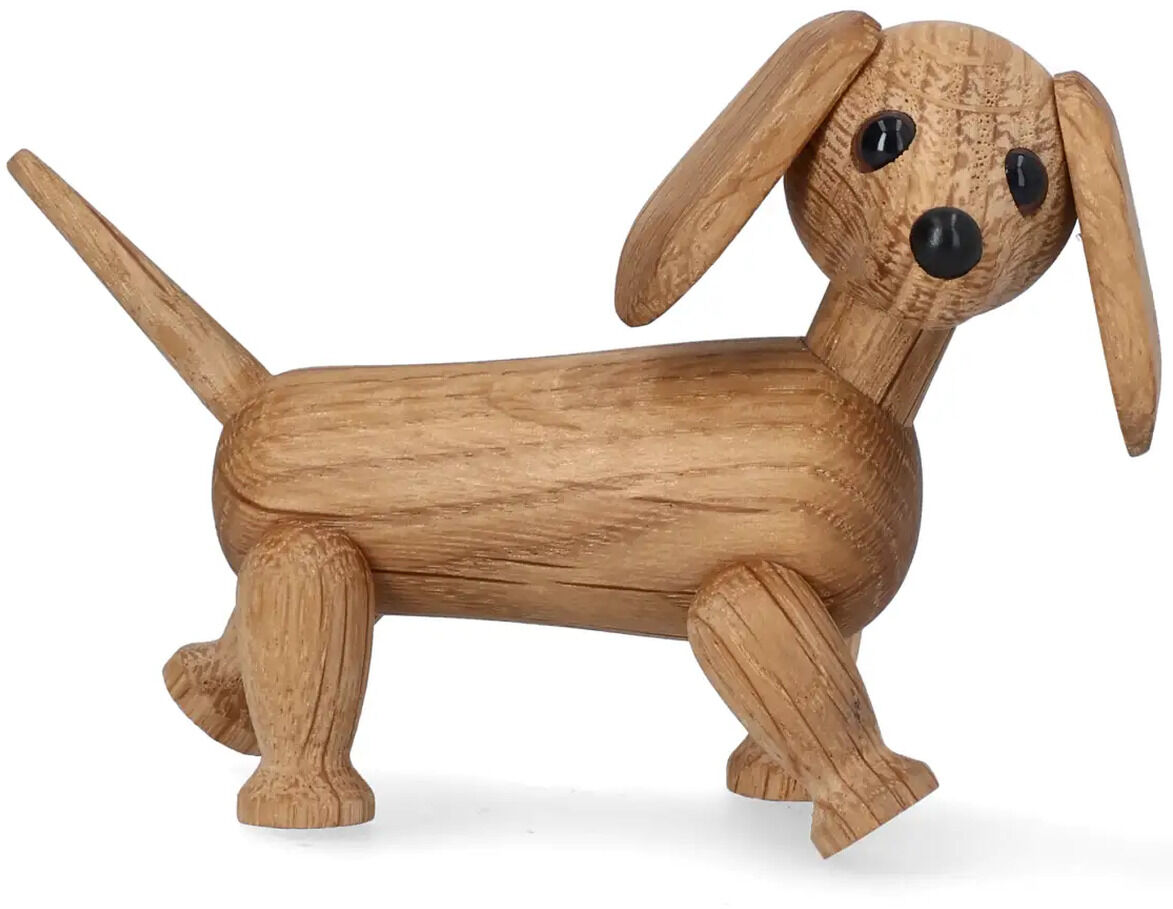 Die Holzfigur »Dackel Chico« der Marke Spring Copenhagen zeigt einen stilisierten Dackel aus hellem Holz mit langen Ohren, schwarzer Nase und schwarzen Augen. Die detailreiche Figur steht auf vier Beinen und hat einen hochgestellten Schwanz. Schlichtes, freundliches Design.