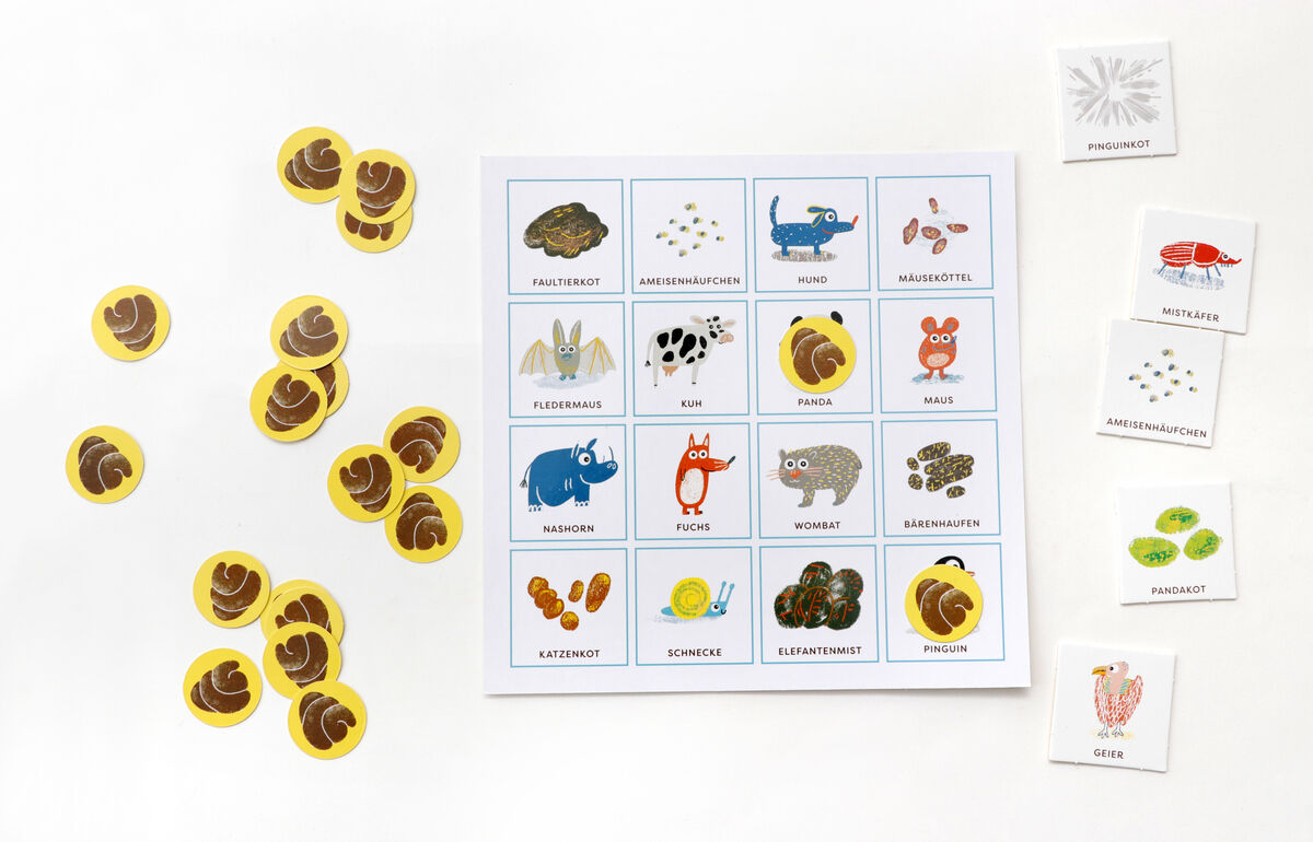 Tierkacke Bingo: Ein Lernspiel bestehend aus einer Bingo-Karte und mehreren runden Spielkarten mit Illustrationen verschiedener Tierexkremente und Tieren.
