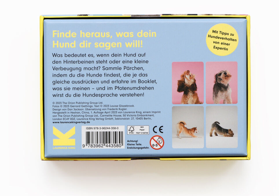 Verpackung des Memo-Spiels »Hundesprache - Verstehst du deinen Hund?« mit verschiedenen spielenden Hunden und einer Beschreibung auf der Rückseite. Enthält ein Bild eines Hundes, der knurrt, sowie eines Hundes, der bellt.