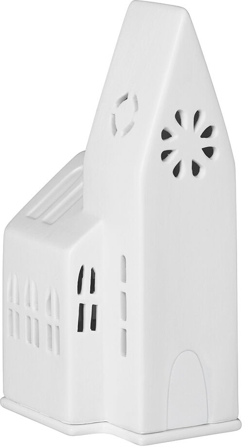 Keramisches Lichthaus in Form einer kleinen Kirche in weiß. Das Haus hat einen hohen Turm mit ausgeschnittenen Fenstern und Details, welche das Licht schön durchscheinen lassen. Perfekt als festliche Dekoration zur Weihnachtszeit.