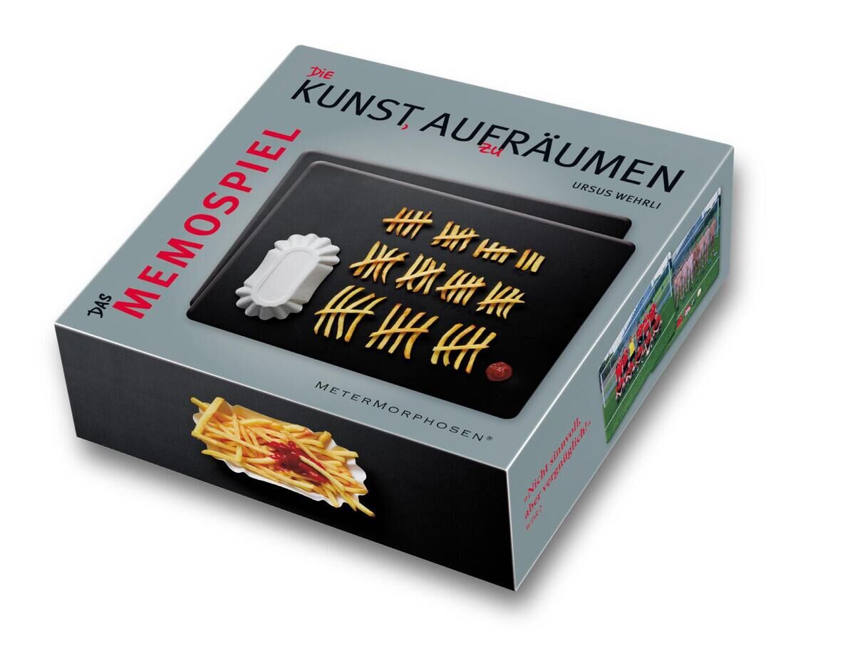 Ein Bild eines Memospiels namens 'Die Kunst, aufzuräumen'. Die Verpackung zeigt ein Spiel mit Pommes-förmigen Plättchen auf einem schwarzen Hintergrund und ist in den Farben Grau, Schwarz, Gelb, Weiß und Rot gehalten.