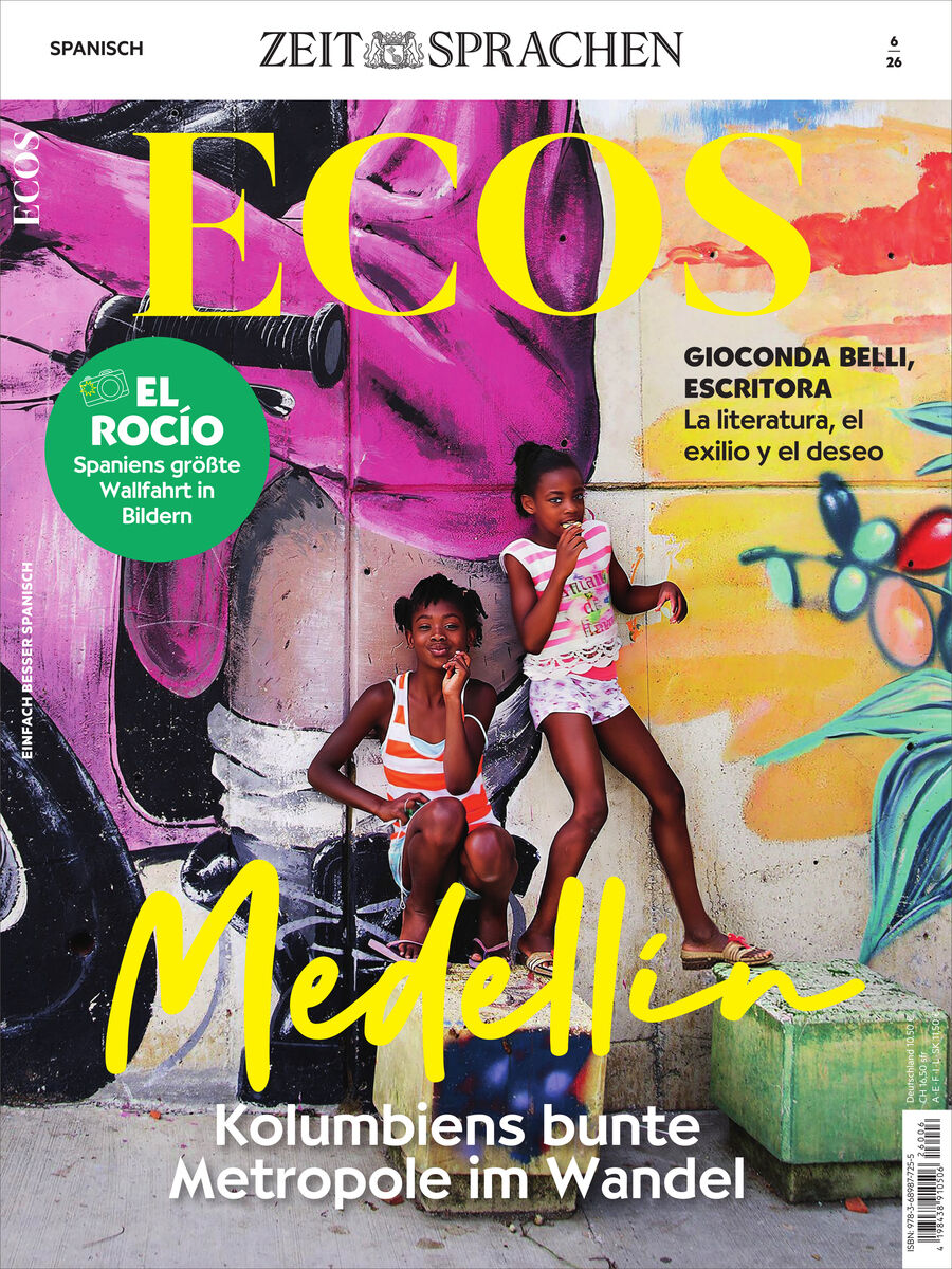 Titelbild des Ecos Magazin 6/2026 von Spotlight Verlag. Zwei fröhliche Mädchen sitzen vor einer bunten Wand mit Graffiti-Kunst in Medellín, Kolumbien. Titel und Text in auffälligem Gelb und Weiß, daneben Hinweise auf Artikel zu Literatur, Reisefotos und Stadtkultur.
