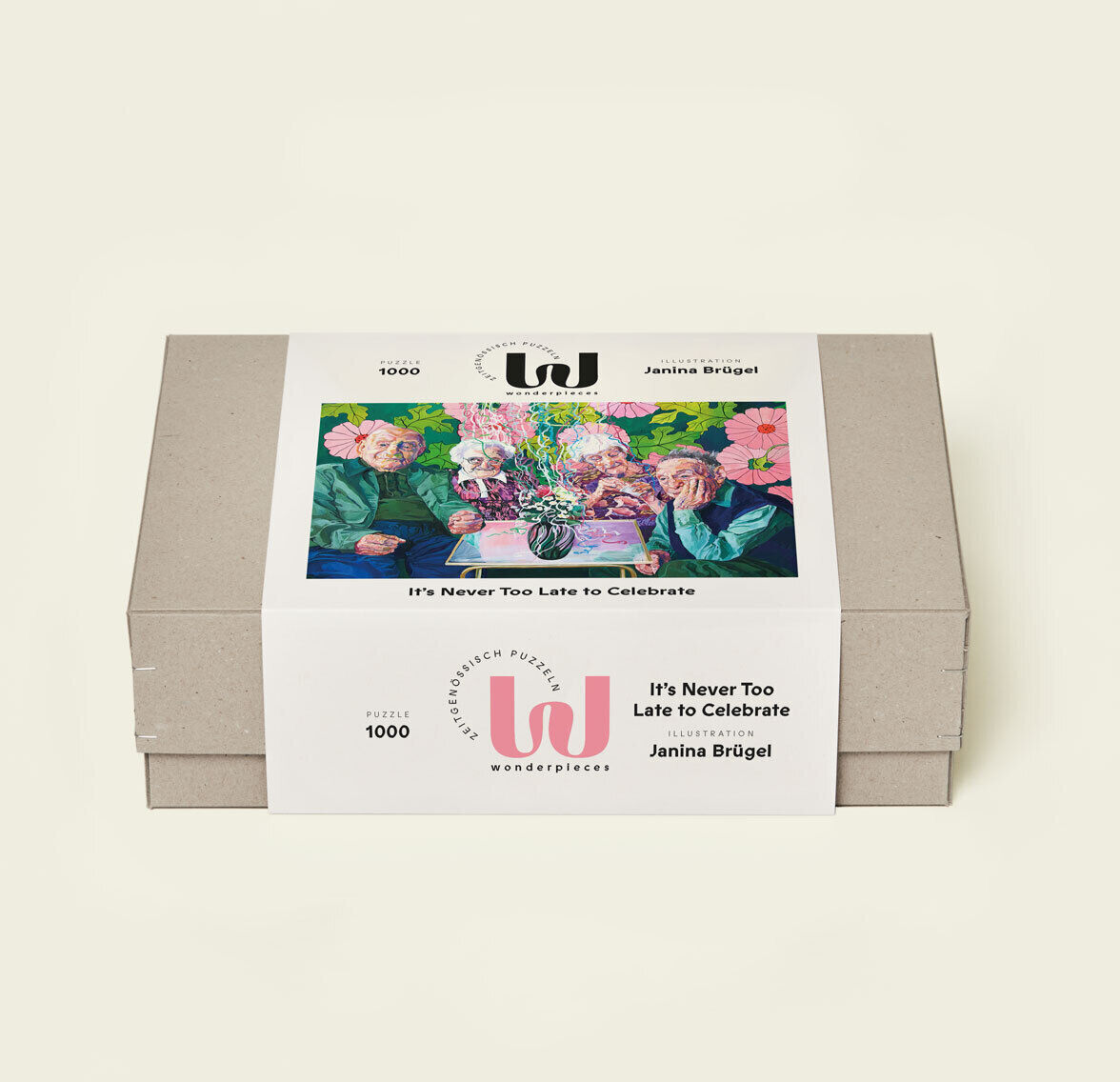 Das Bild zeigt ein Puzzle mit dem Titel 'It's Never Too Late to Celebrate'. Die Verpackung zeigt ein kunstvolles Motiv mit Blumen in farbenfrohen Tönen. Die Schachtel selbst ist in einem neutralen Beige gehalten.