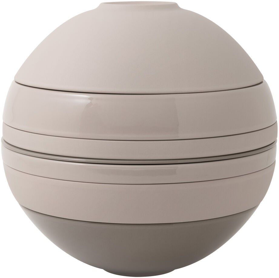Das Bild zeigt das „La Boule“ Geschirr-Set in einer modernen, kugelförmigen Anordnung. Die Oberflächen sind in Beige und Grau gehalten und teils matt, teils glänzend. Das Design ist minimalistisch und platzsparend, ideal für stilvolle Esstafeln.