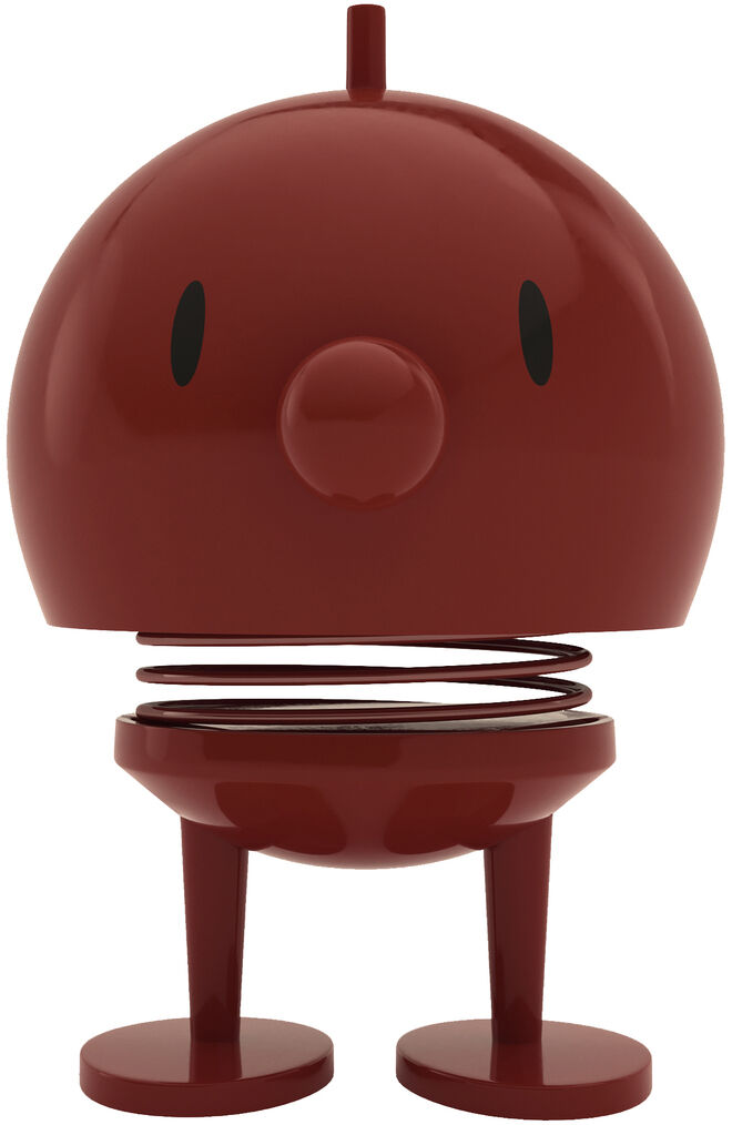 Das Bild zeigt einen Hoptimist Bumble Maroon der Marke Hoptimist in Größe M. Die Figur ist bordeauxrot, besteht aus ABS und Stahl, hat eine runde Form, schwarze Augen, Nase sowie eine sichtbare Stahlfeder zwischen Kopf und Körper, steht auf zwei Beinen, vor weißem Hintergrund.